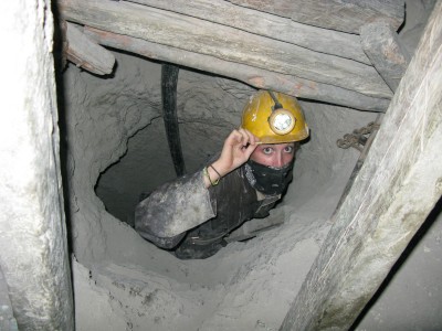 Lin crawling down one of the tiny 20 foot shafts Lin crawling down one of the tiny 20 foot shafts