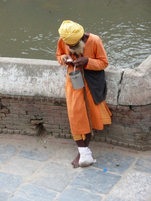 Sadhu in Pashupatinath kathmandu nepal Sadhu counting his change