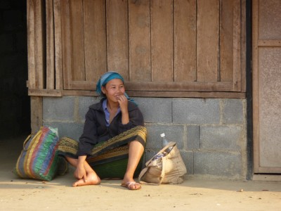 Girl waiting at the bus stop laos Girl waiting at the bus stop